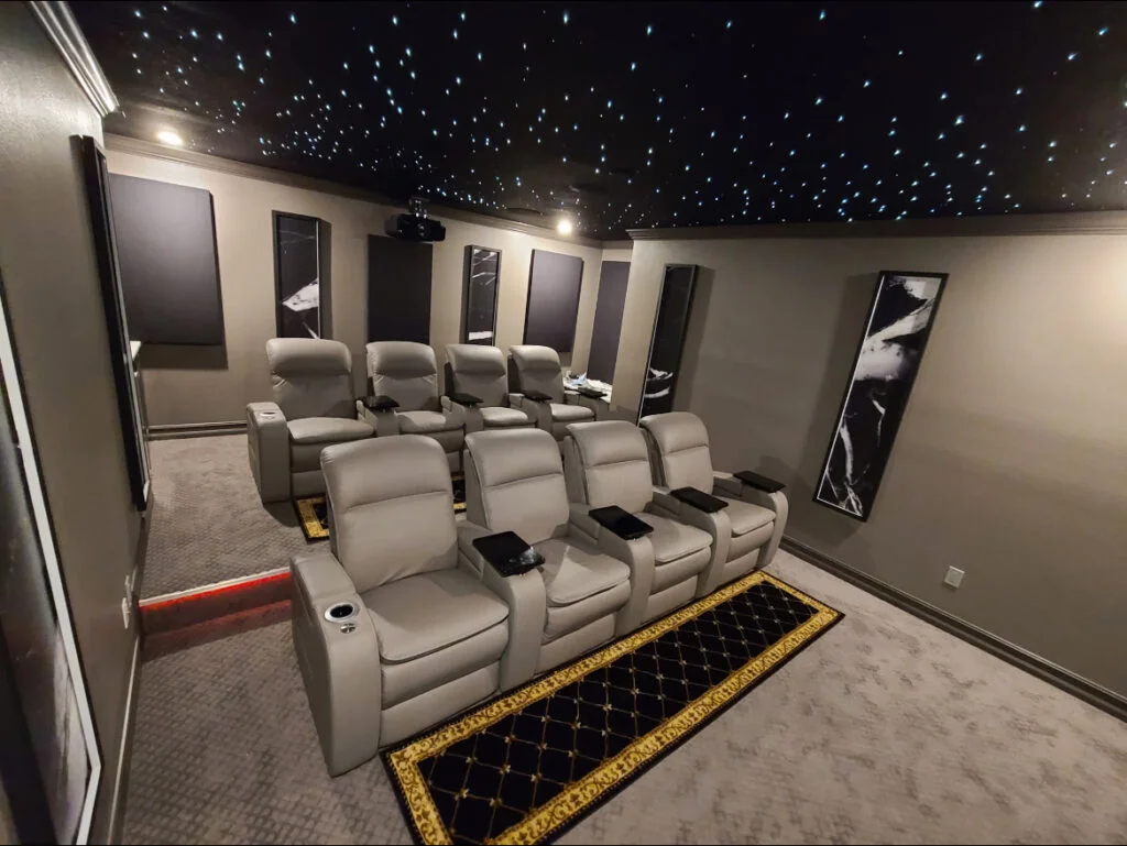 Custom home theater installation with ambient lighting and seating setup