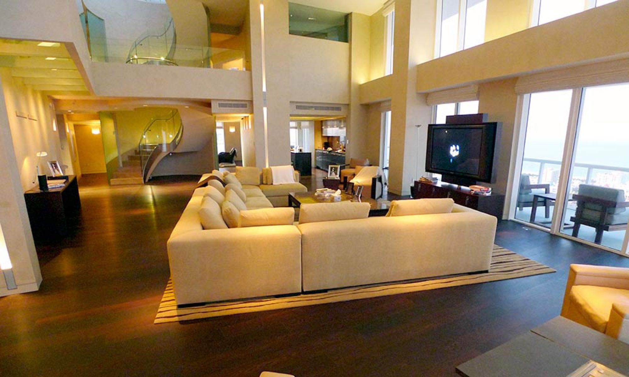 Large open-concept luxury living room with a sectional sofa and television