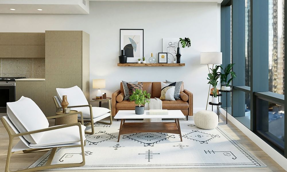 Modern living room with tan leather sofa, white armchairs, and Southwestern-pattern area rug.